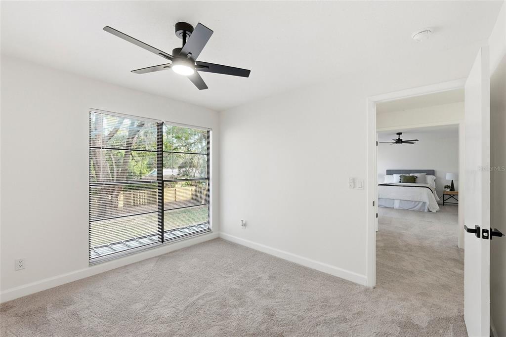 404 Bryan Oak Avenue Brandon, FL 33511 - Photo 29 of 43 an empty room with windows and ceiling fan