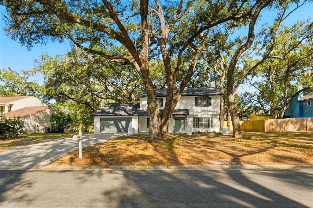 404 Bryan Oak Avenue Brandon, FL 33511 - Photo 34 of 43 a front view of a building with a garden