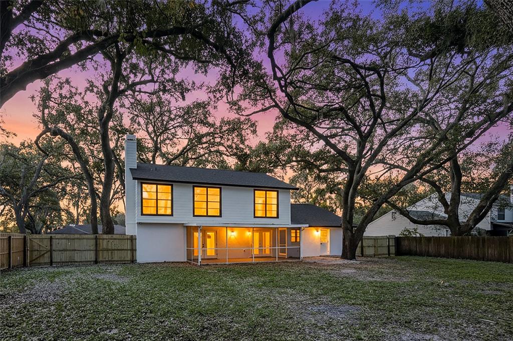 404 Bryan Oak Avenue Brandon, FL 33511 - Photo 37 of 43 a front view of house with yard and trees in the background