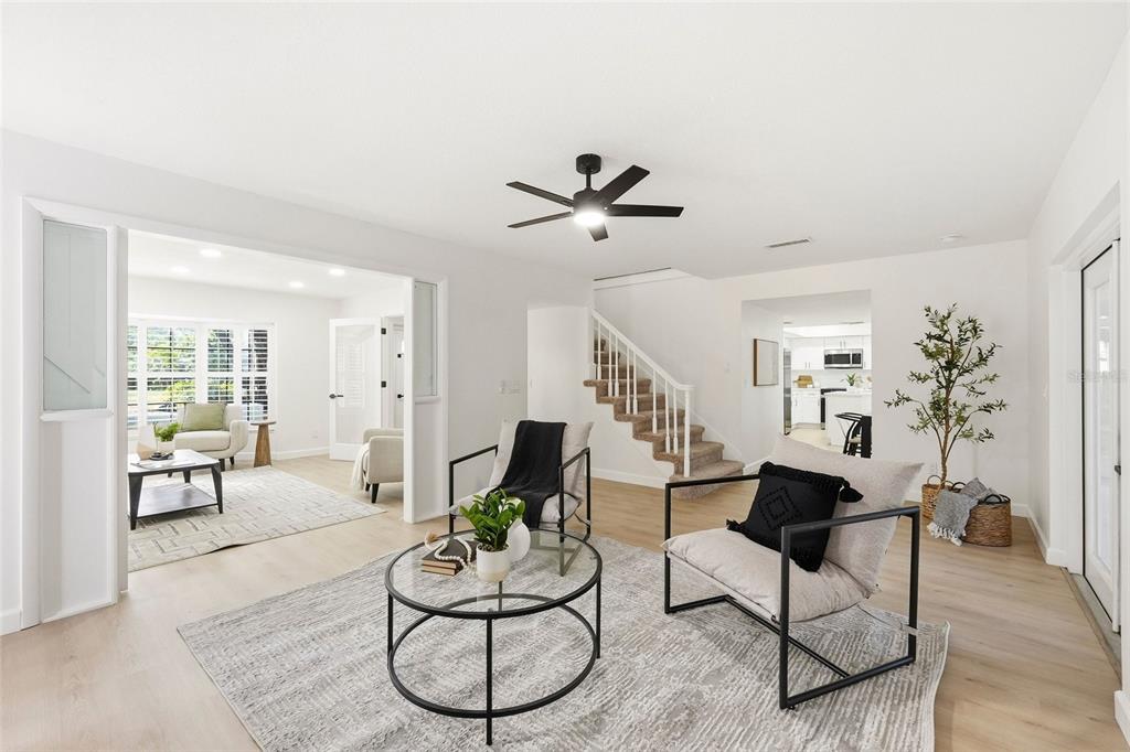 404 Bryan Oak Avenue Brandon, FL 33511 - Photo 5 of 43 a living room with furniture a dining table and a potted plant