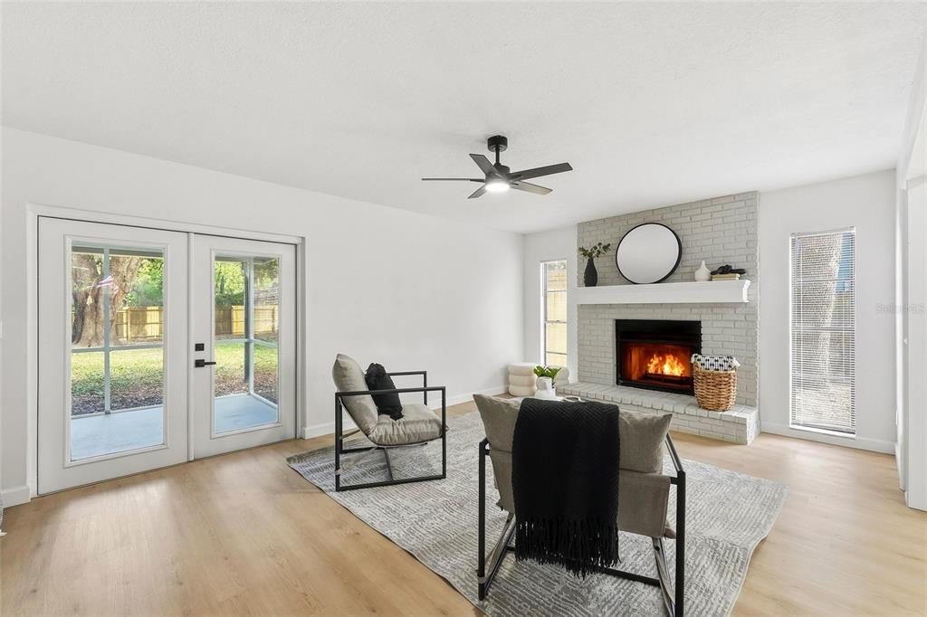 404 Bryan Oak Avenue Brandon, FL 33511 - Photo 7 of 43 a living room with furniture and a fireplace