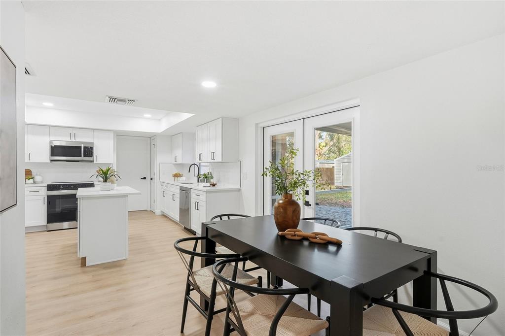 404 Bryan Oak Avenue Brandon, FL 33511 - Photo 9 of 43 a view of a dining room with furniture and wooden floor