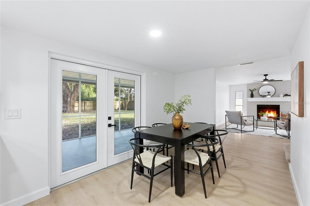 404 Bryan Oak Avenue Brandon, FL 33511 - Photo 10 of 43 a view of a dining room with furniture and wooden floor
