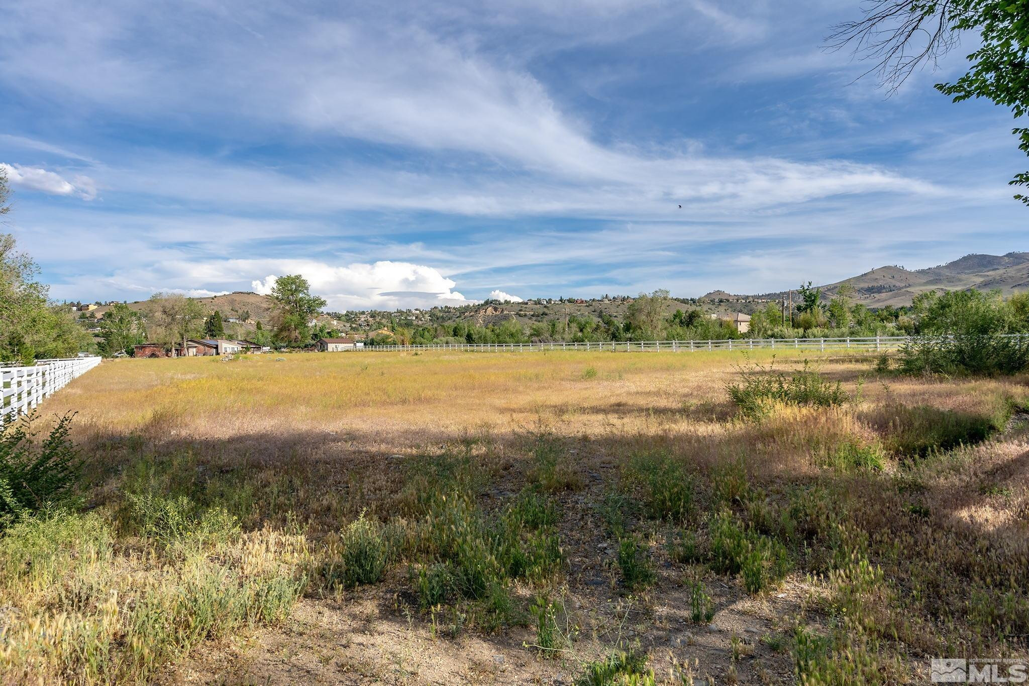 160 Juniper Hill Road Reno, NV 89519 - Photo 4 of 11 a view of a lake with houses in the back