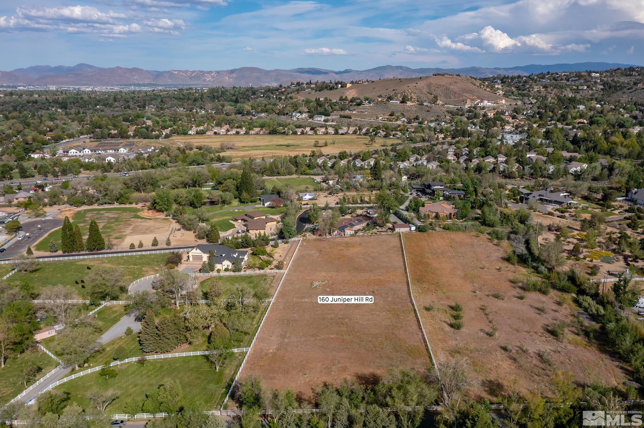 160 Juniper Hill Road Reno, NV 89519 - Photo 5 of 11 a view of a city with mountains in the background