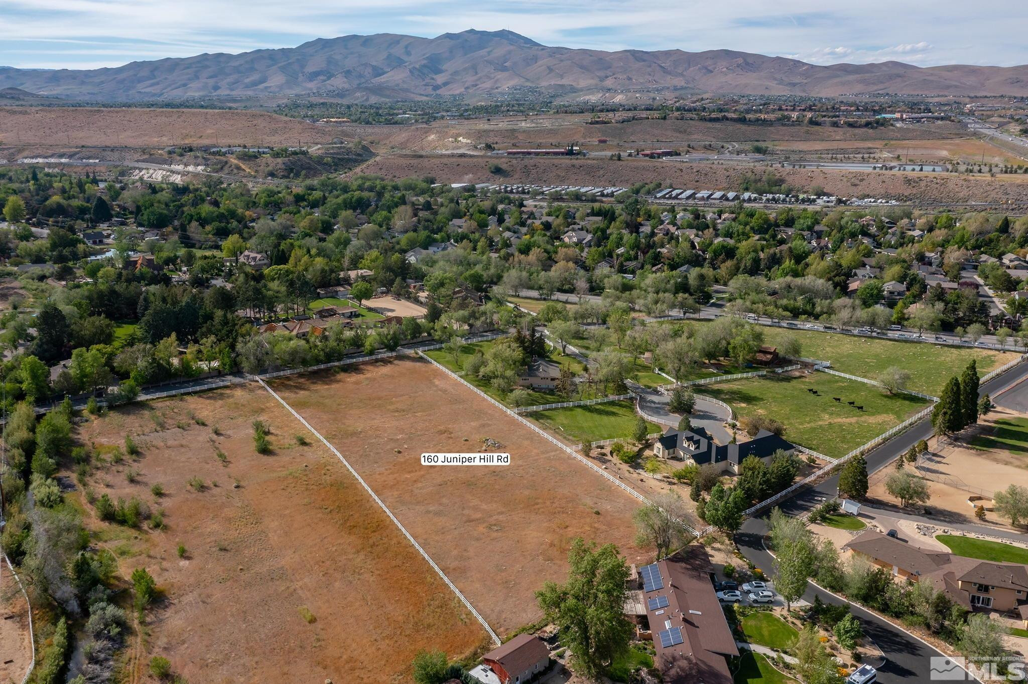 160 Juniper Hill Road Reno, NV 89519 - Photo 8 of 11 a view of a lake in middle of the town