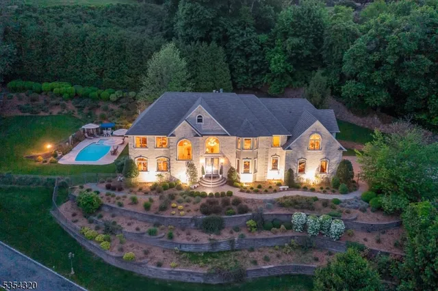 a view of an houses with swimming pool and a yard