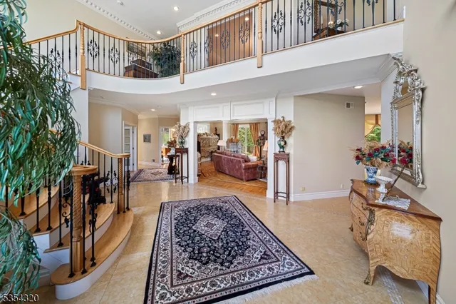 a view of entryway and hall with a front door