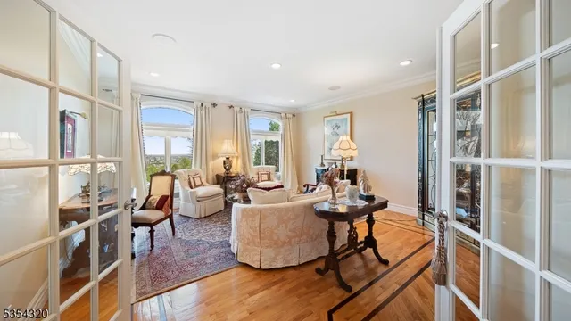 a living room with furniture fireplace and a window