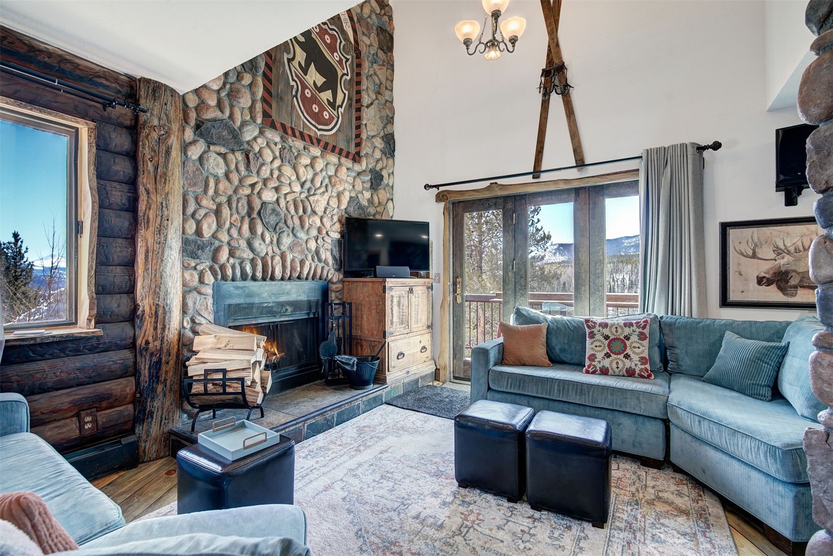 9460 Ryan Gulch Road, Unit 9460 Silverthorne, CO 80498 - Photo 7 of 39 a living room with furniture and a fireplace