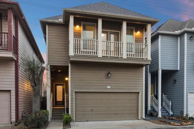 a front view of a house with garage