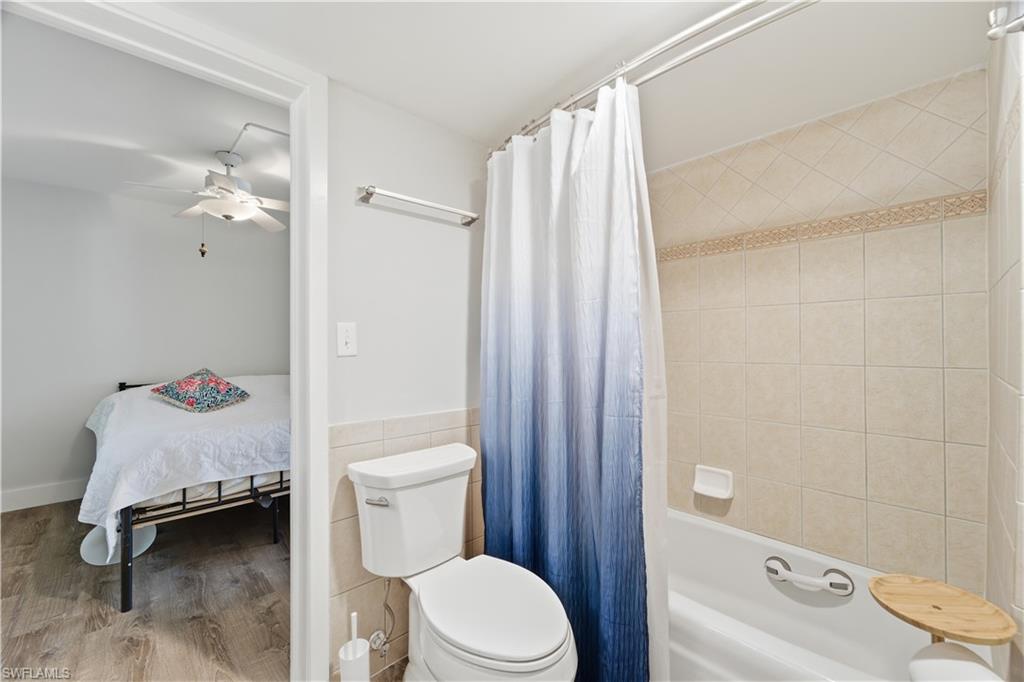 975 9th Avenue South, Unit 11 Naples, FL 34102 - Photo 14 of 19 a bathroom with a sink toilet and shower