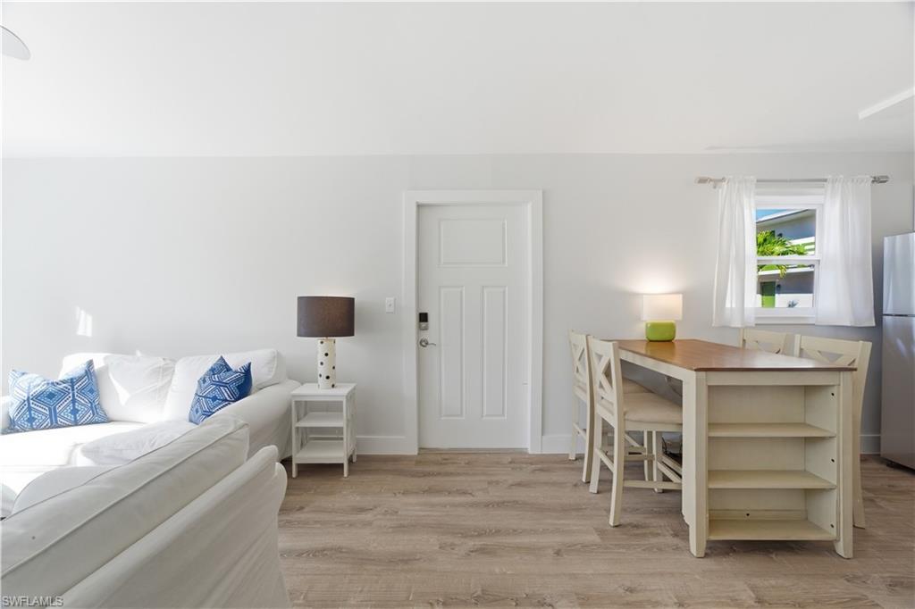 975 9th Avenue South, Unit 11 Naples, FL 34102 - Photo 7 of 19 a living room with furniture and a window