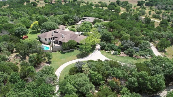 an aerial view of house with yard