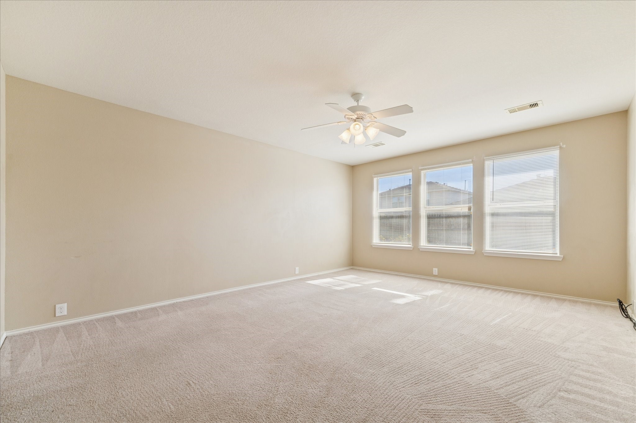 1034 Clover Leaf Court Rosenberg, TX 77469 - Photo 4 of 21 an empty room with a empty space and a window