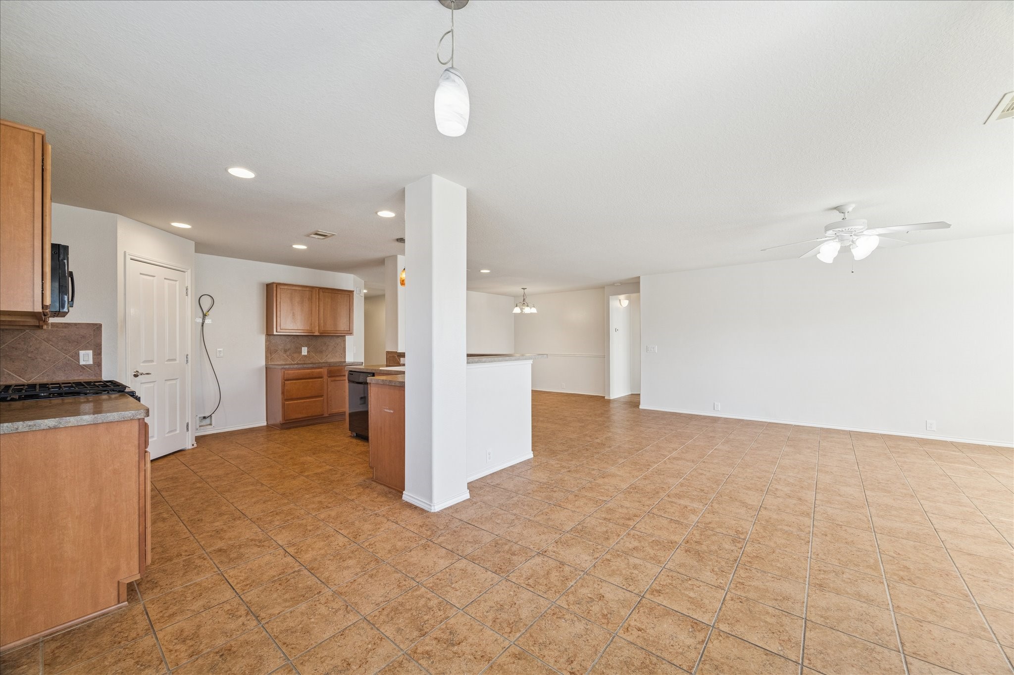 1034 Clover Leaf Court Rosenberg, TX 77469 - Photo 9 of 21 a view of a kitchen with a sink and a refrigerator