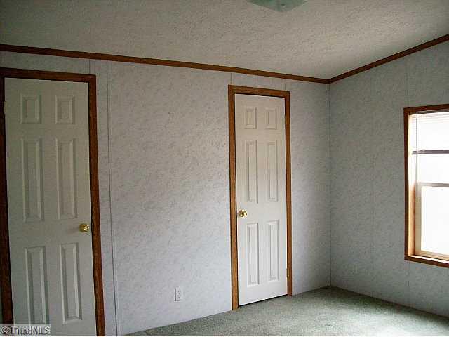 588 Fred Lanier Road Mocksville, NC 27028 - Photo 11 of 12 2nd Bedroom. One of the two additional bedrooms. This one has walk-thru closets whereas the other has a walk in closet
