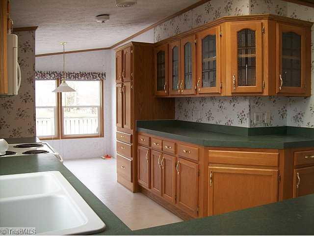 588 Fred Lanier Road Mocksville, NC 27028 - Photo 4 of 12 Kitchen. Dishwasher, oven/range and built-in microwave remain