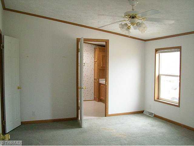 588 Fred Lanier Road Mocksville, NC 27028 - Photo 8 of 12 Master Bedroom. Master suite with walk in closet