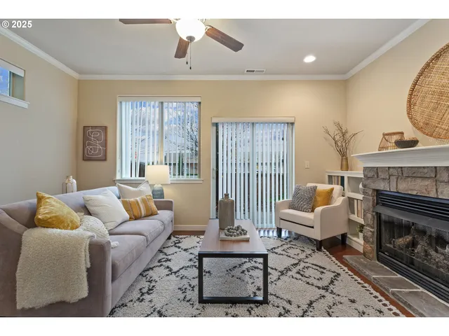 a living room with furniture and a fireplace
