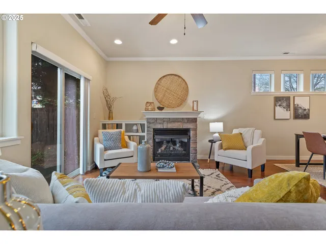 a living room with furniture and a fireplace