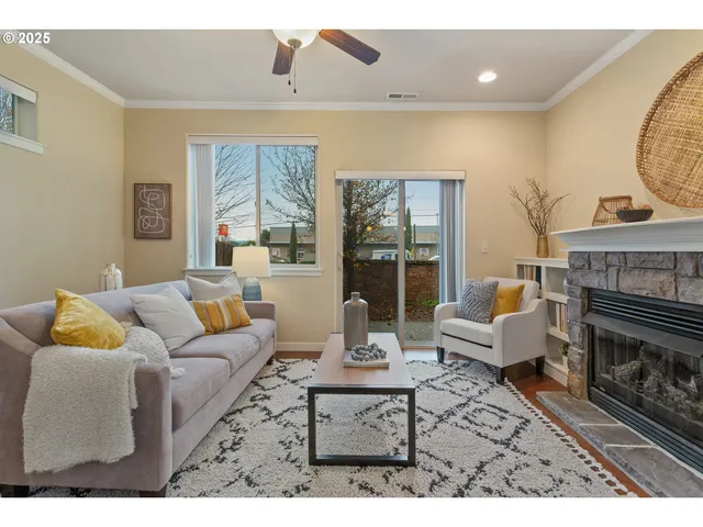 a living room with furniture and a fireplace