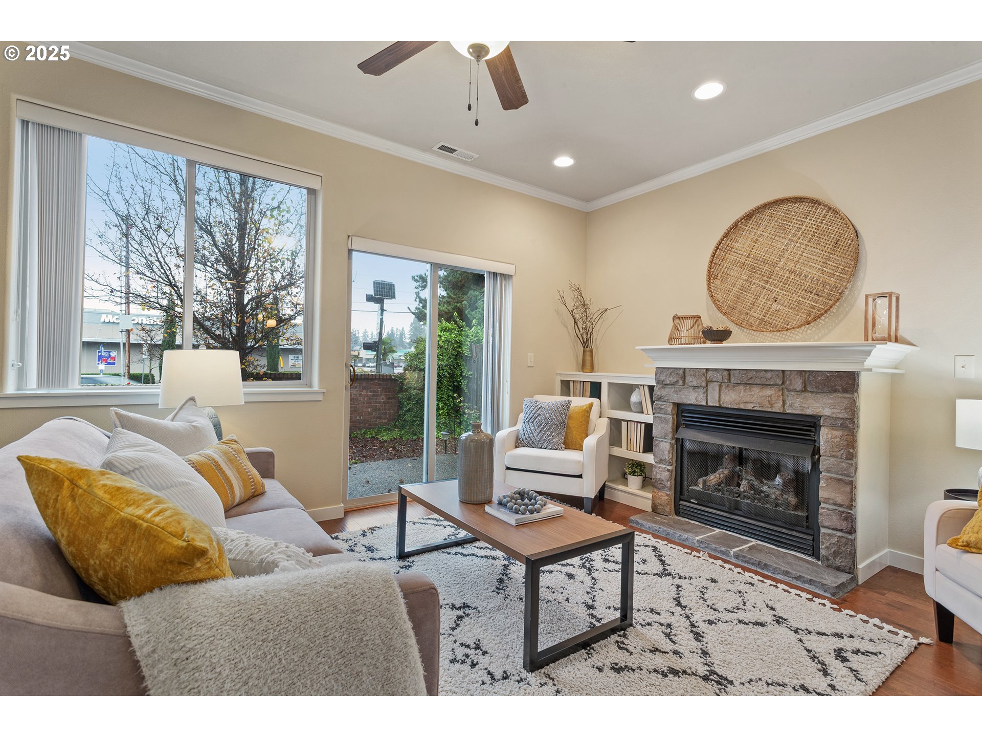17515 Southwest Vanguard Lane Beaverton, OR 97007 - Photo 15 of 34 a living room with furniture a fireplace and floor to ceiling windows