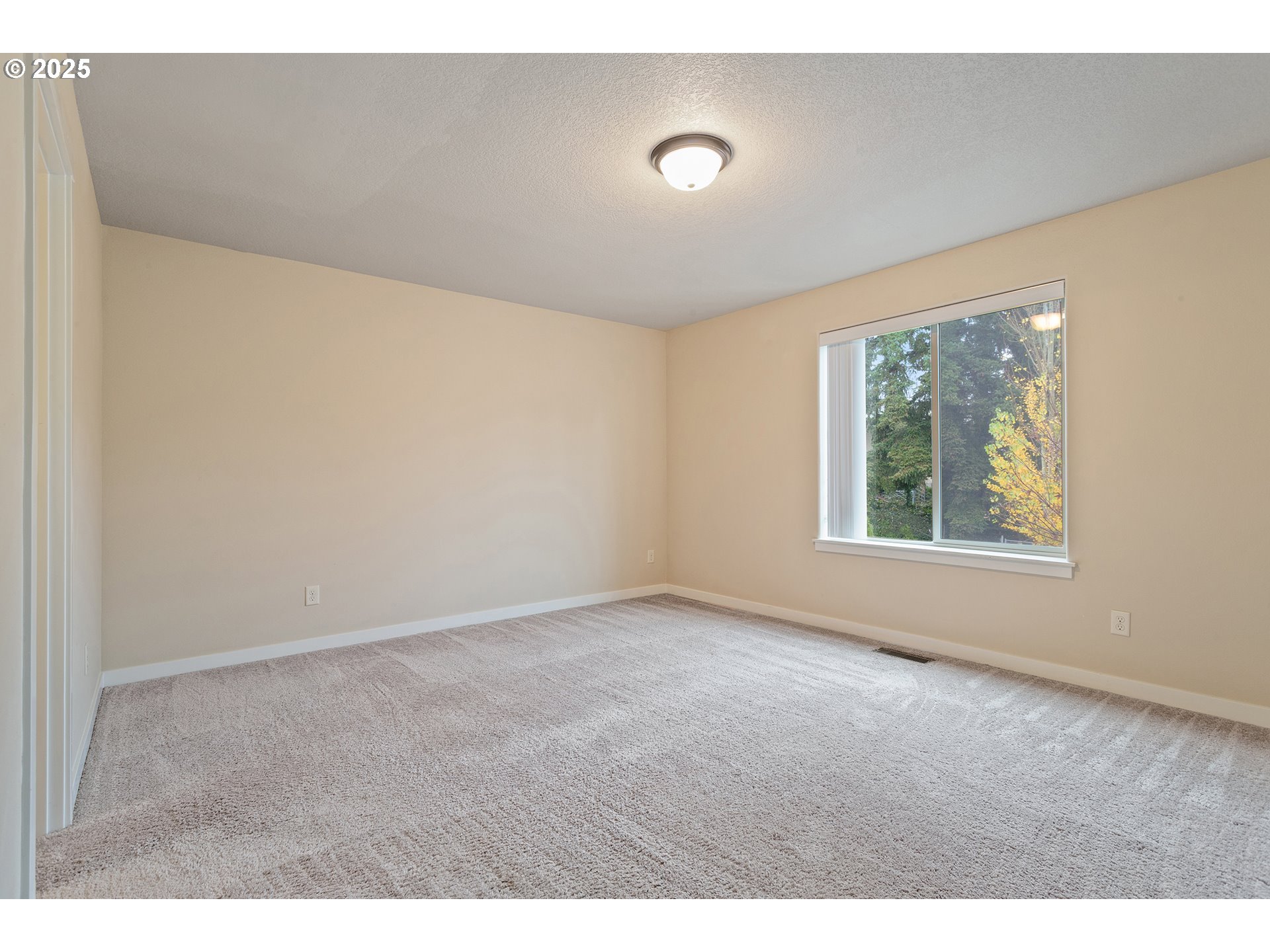 17515 Southwest Vanguard Lane Beaverton, OR 97007 - Photo 17 of 34 a view of an empty room with a window