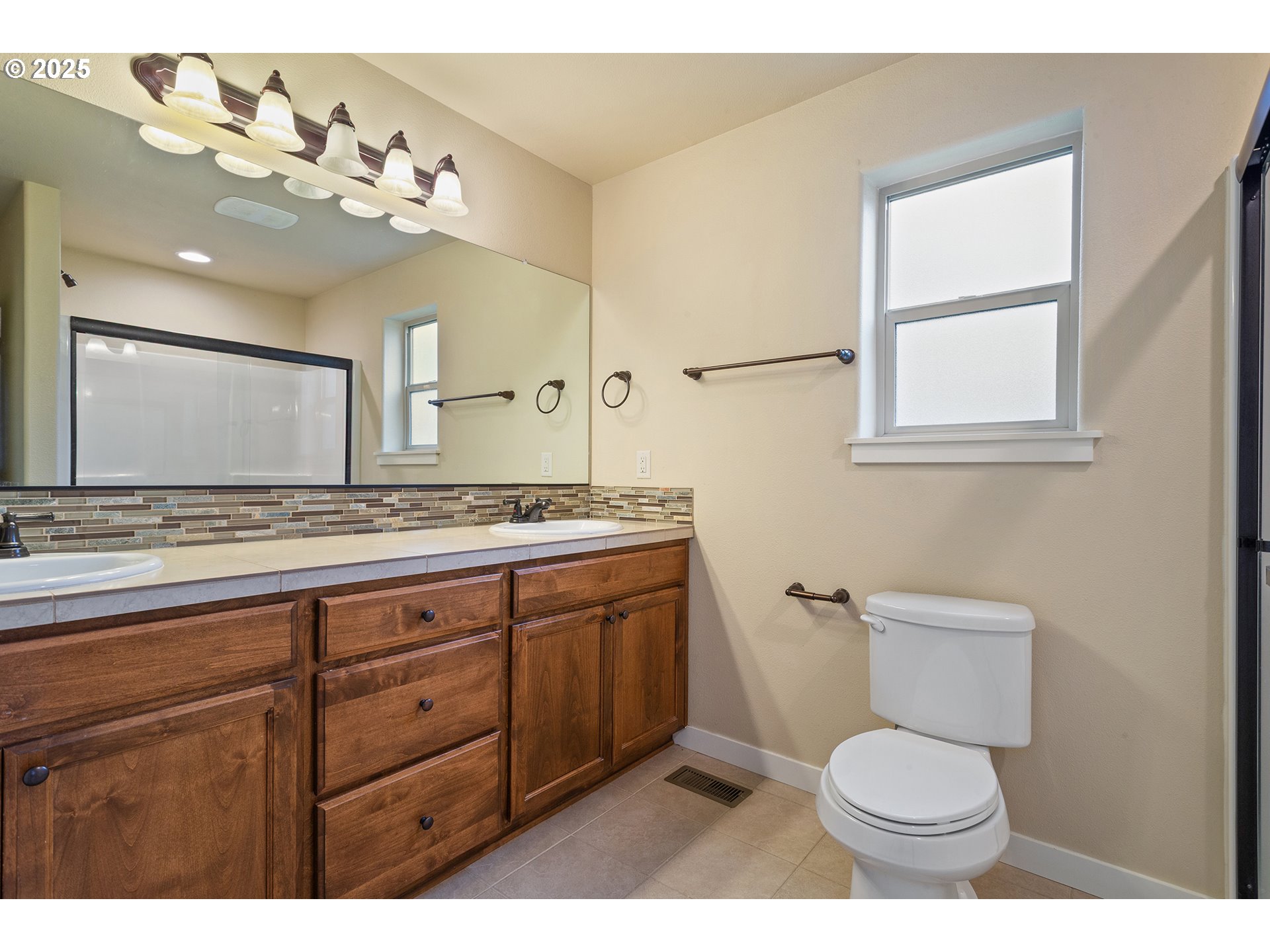 17515 Southwest Vanguard Lane Beaverton, OR 97007 - Photo 21 of 34 a bathroom with a toilet a sink and mirror