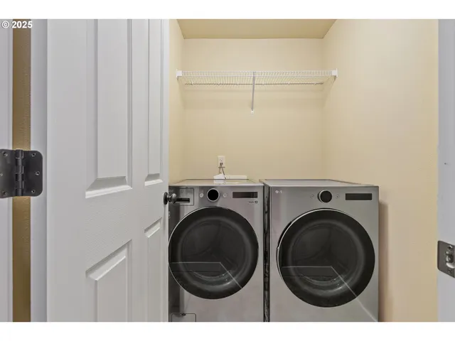 a view of a storage & utility room with washer and dryer