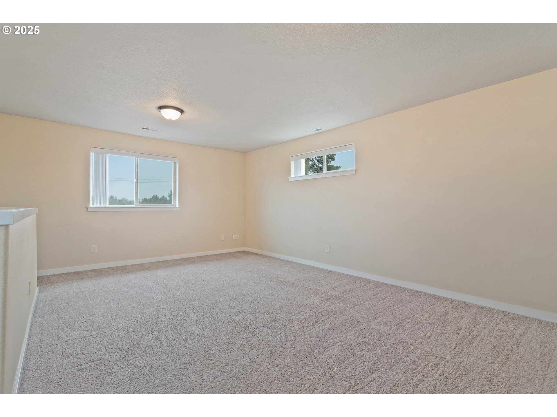 17515 Southwest Vanguard Lane Beaverton, OR 97007 - Photo 30 of 34 a view of an empty room with a window