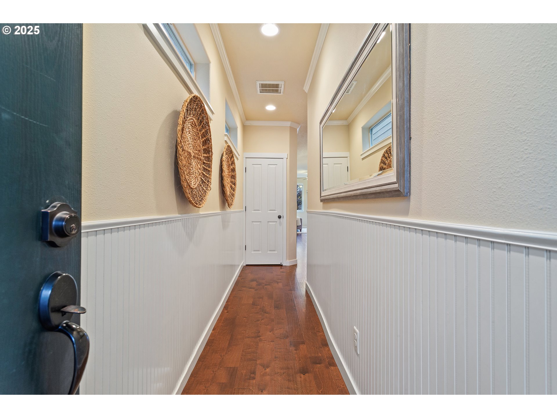 17515 Southwest Vanguard Lane Beaverton, OR 97007 - Photo 3 of 34 a view of a hallway with wooden floor
