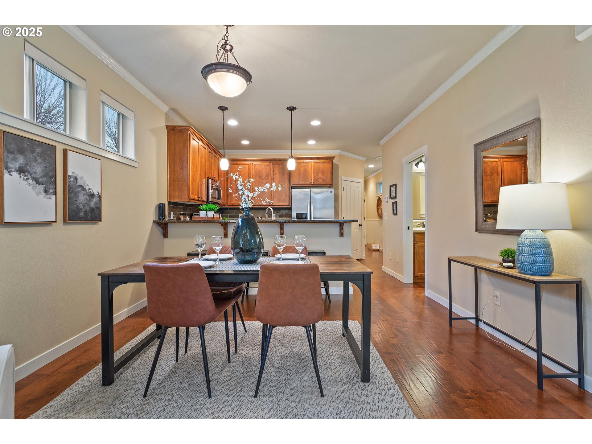 17515 Southwest Vanguard Lane Beaverton, OR 97007 - Photo 8 of 34 a view of a dining room with furniture and wooden floor