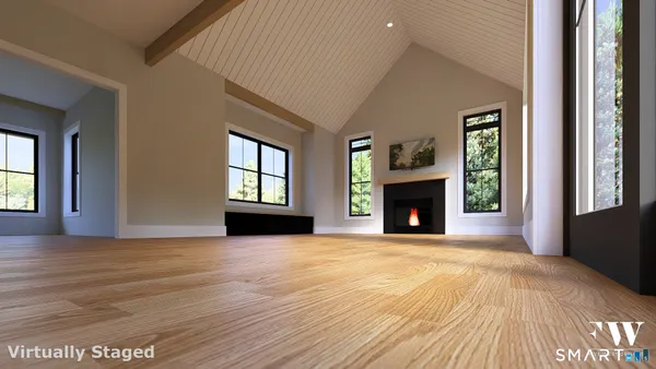 a view of an empty room with window and fireplace