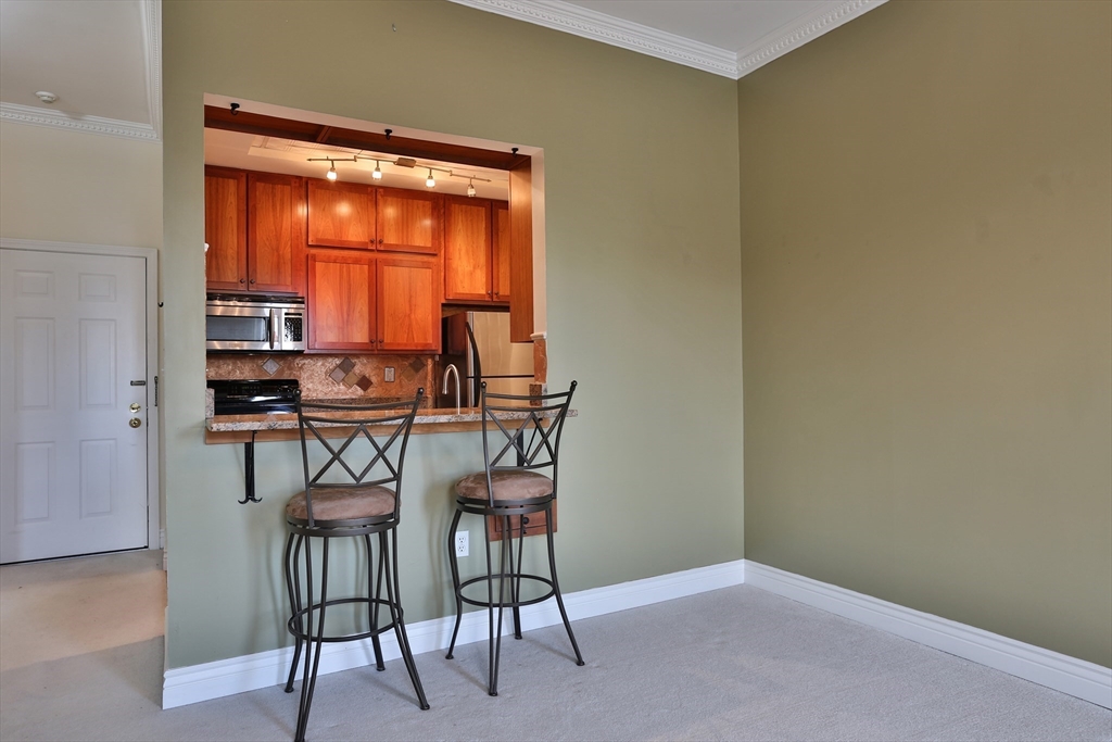 21 South Street, Unit 31 Westborough, MA 01581 - Photo 3 of 19 a dining room with furniture and a window