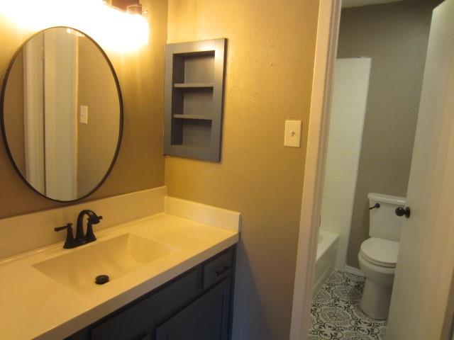 4262 Madera Road Irving, TX 75038 - Photo 11 of 15 a bathroom with a sink and a mirror