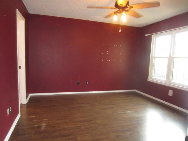 4262 Madera Road Irving, TX 75038 - Photo 12 of 15 an empty room with a window and a fan