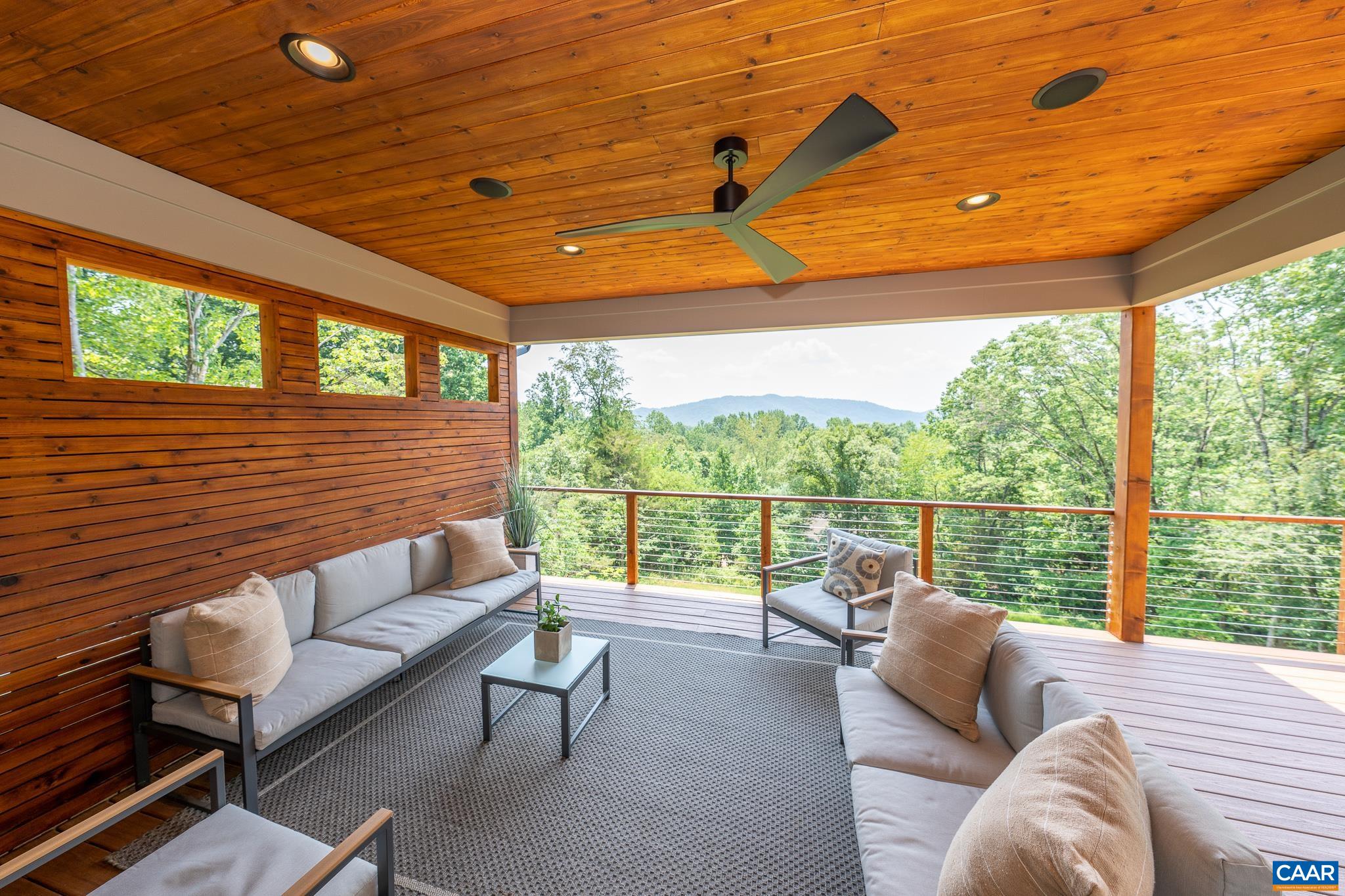 809 Gilliams Mountain Road Charlottesville, VA 22903 - Photo 19 of 68 a balcony with furniture and a large window