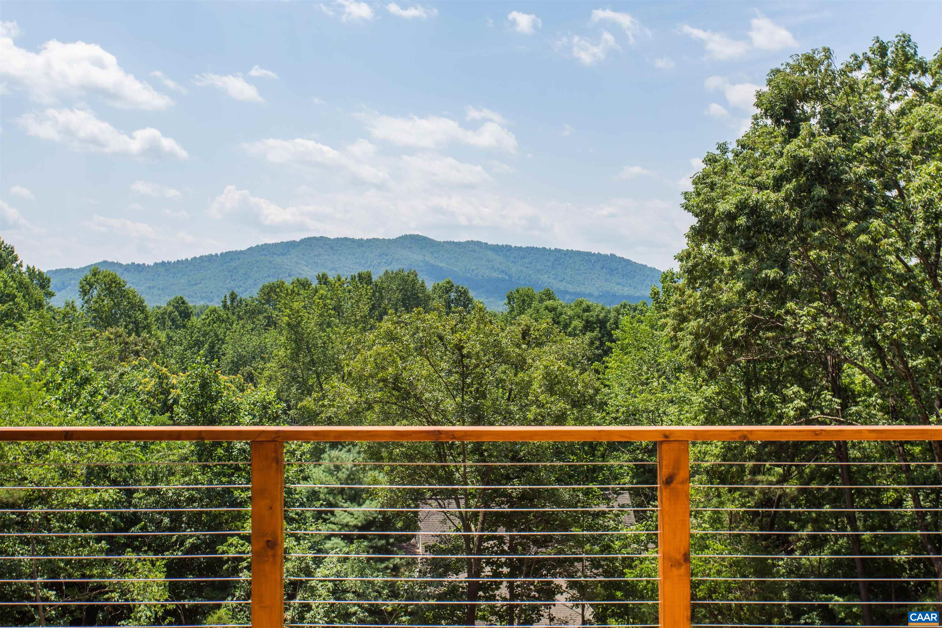 809 Gilliams Mountain Road Charlottesville, VA 22903 - Photo 20 of 68 a view of a balcony with a swing