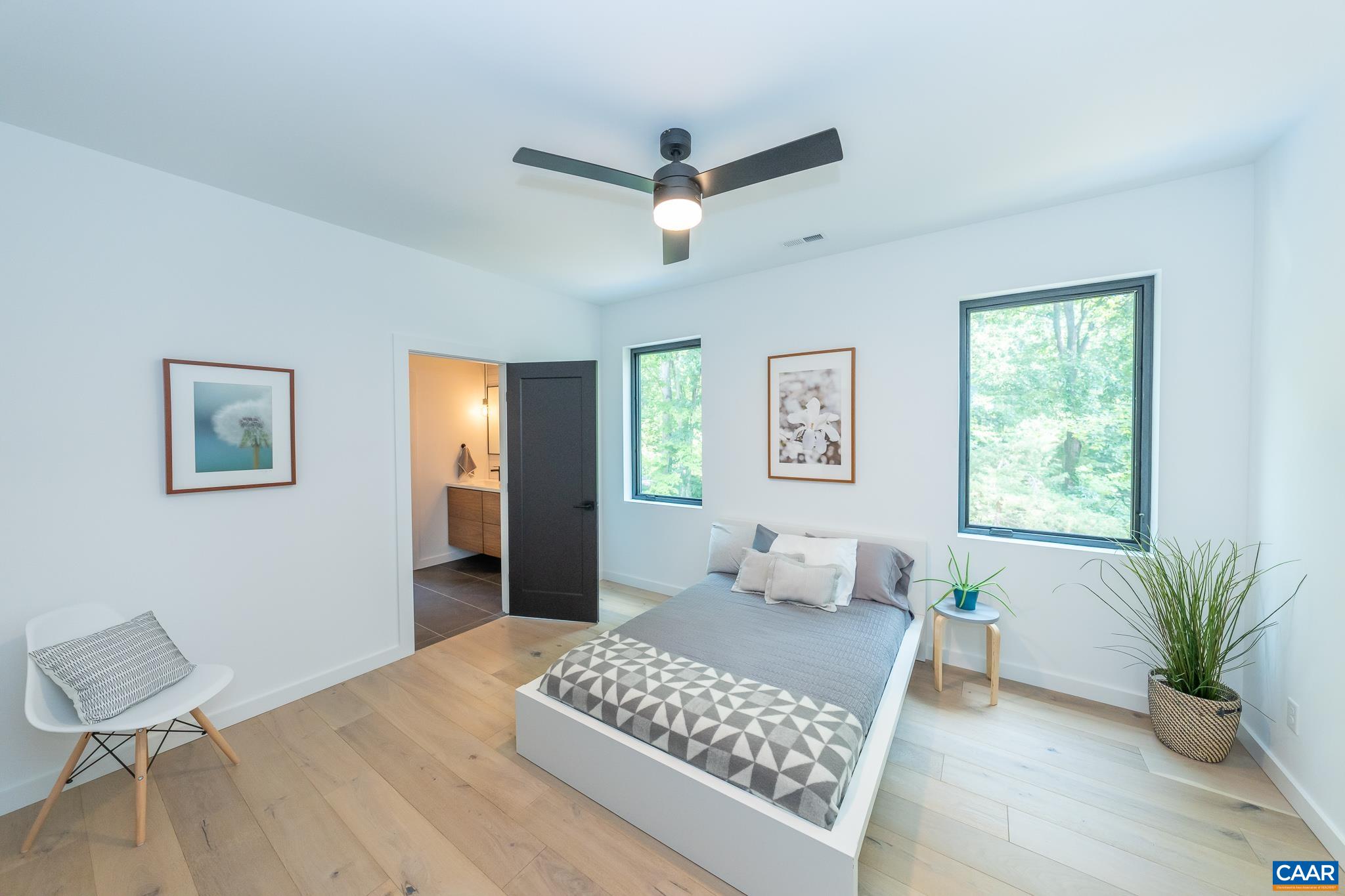 809 Gilliams Mountain Road Charlottesville, VA 22903 - Photo 44 of 68 a bedroom with a bed and wooden floor