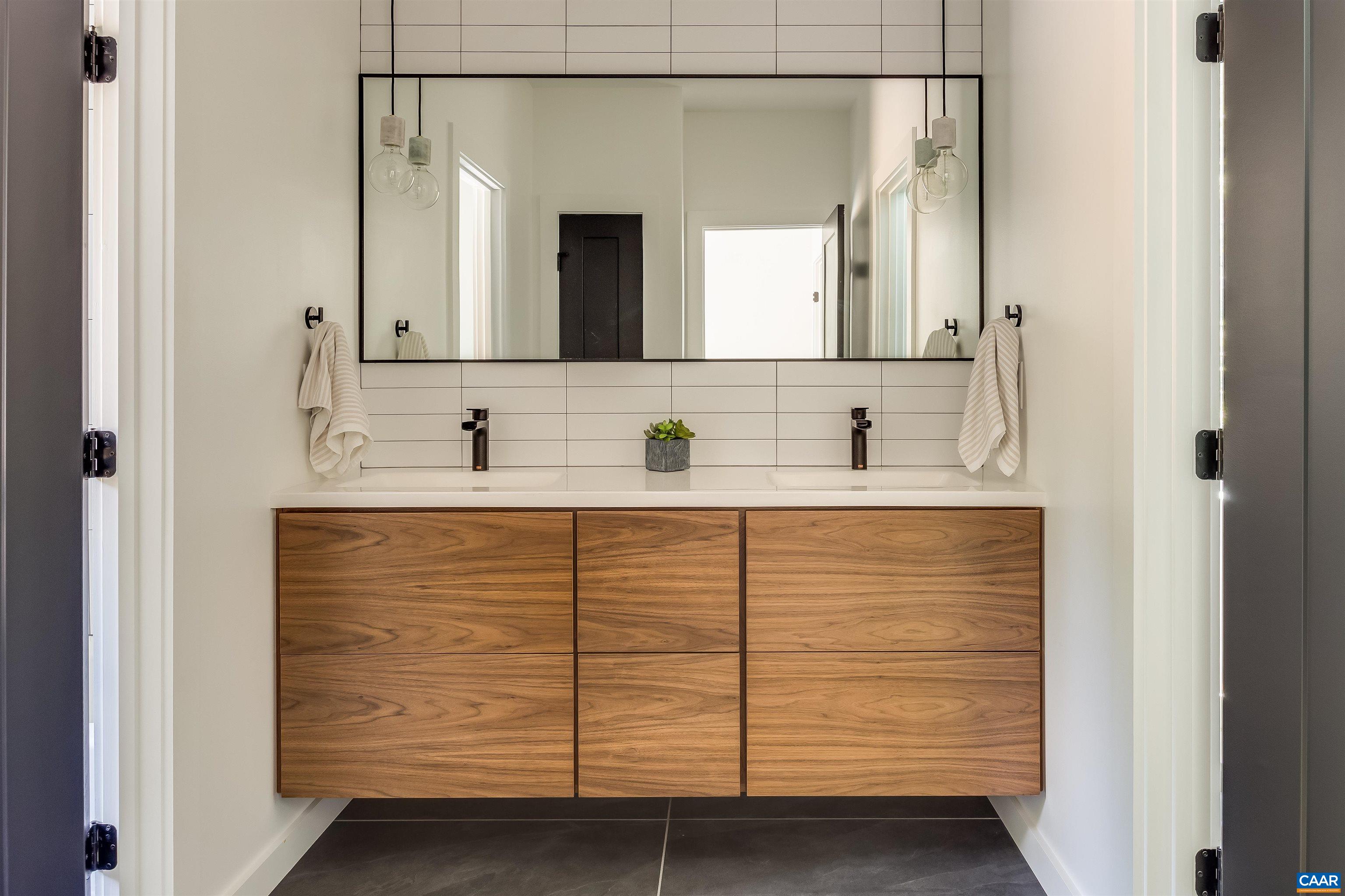 809 Gilliams Mountain Road Charlottesville, VA 22903 - Photo 46 of 68 a bathroom with a sink and a mirror