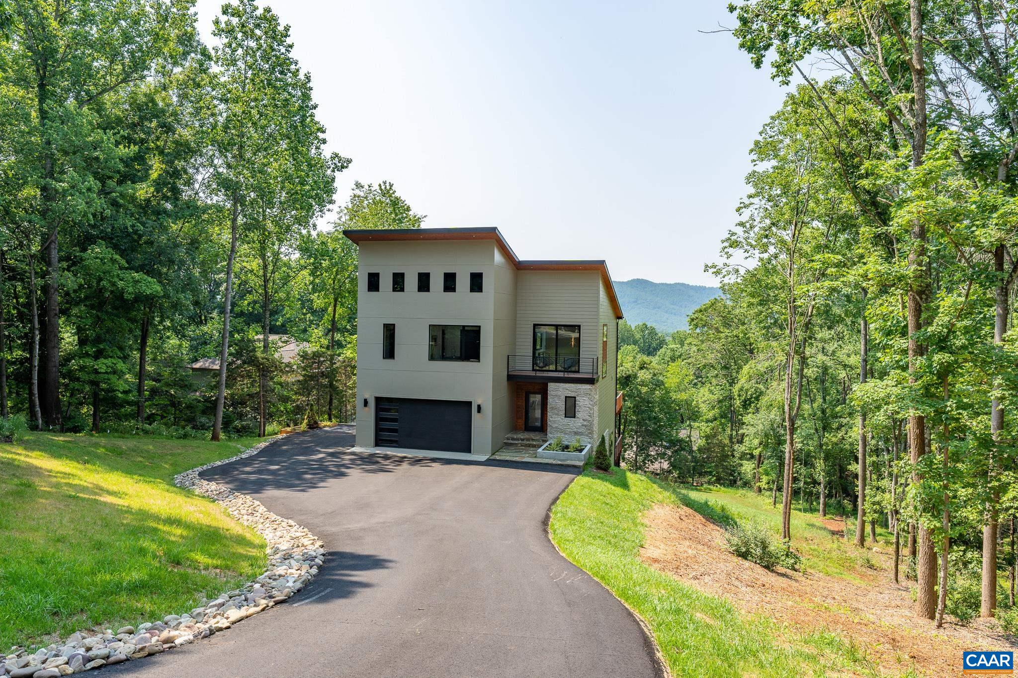 809 Gilliams Mountain Road Charlottesville, VA 22903 - Photo 50 of 68 a view of a house with a yard and large tree