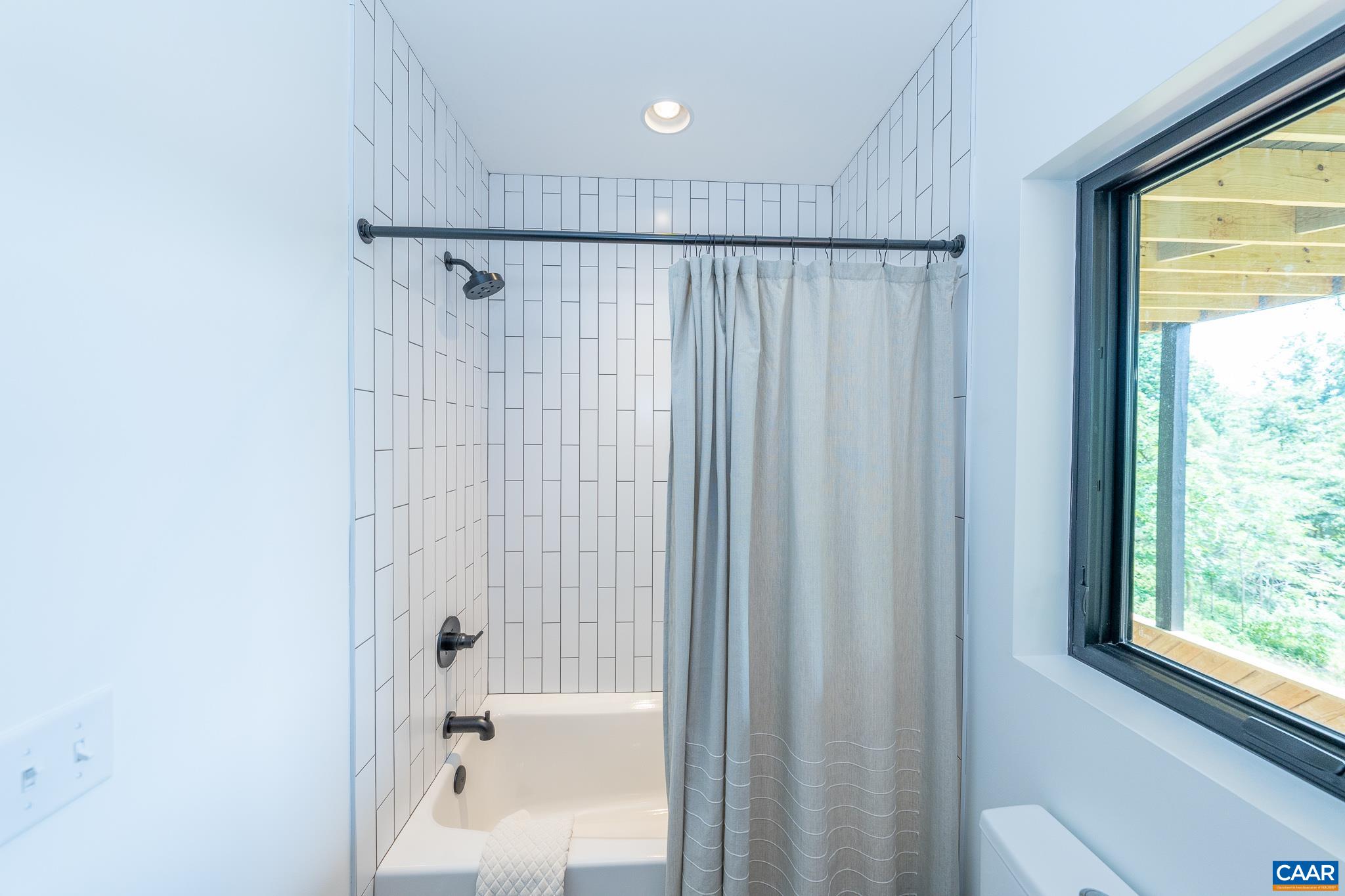 809 Gilliams Mountain Road Charlottesville, VA 22903 - Photo 65 of 68 a bathroom with a shower and a bath tub