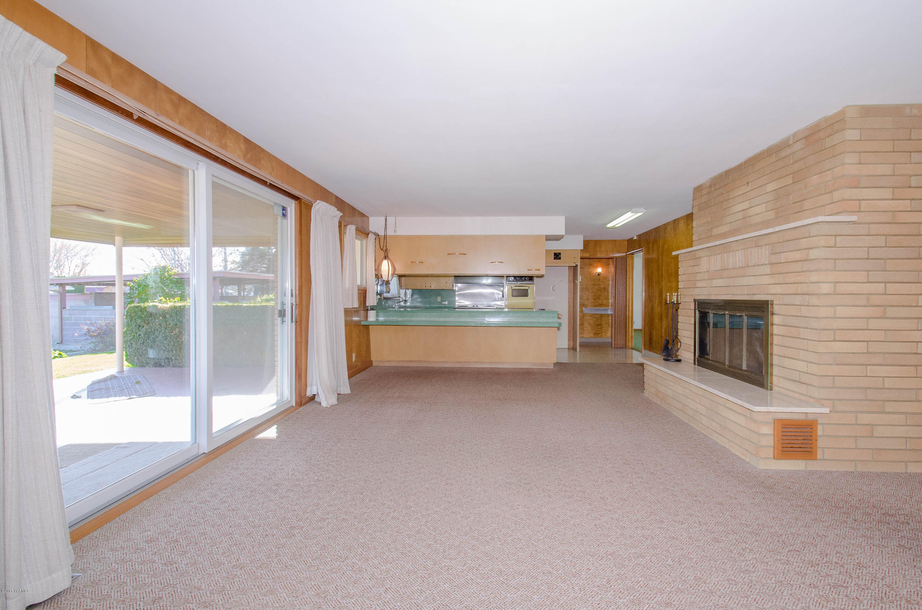 3591 Harrah Road Harrah, WA 98933 - Photo 5 of 20 a view of a livingroom with an empty space and a fireplace