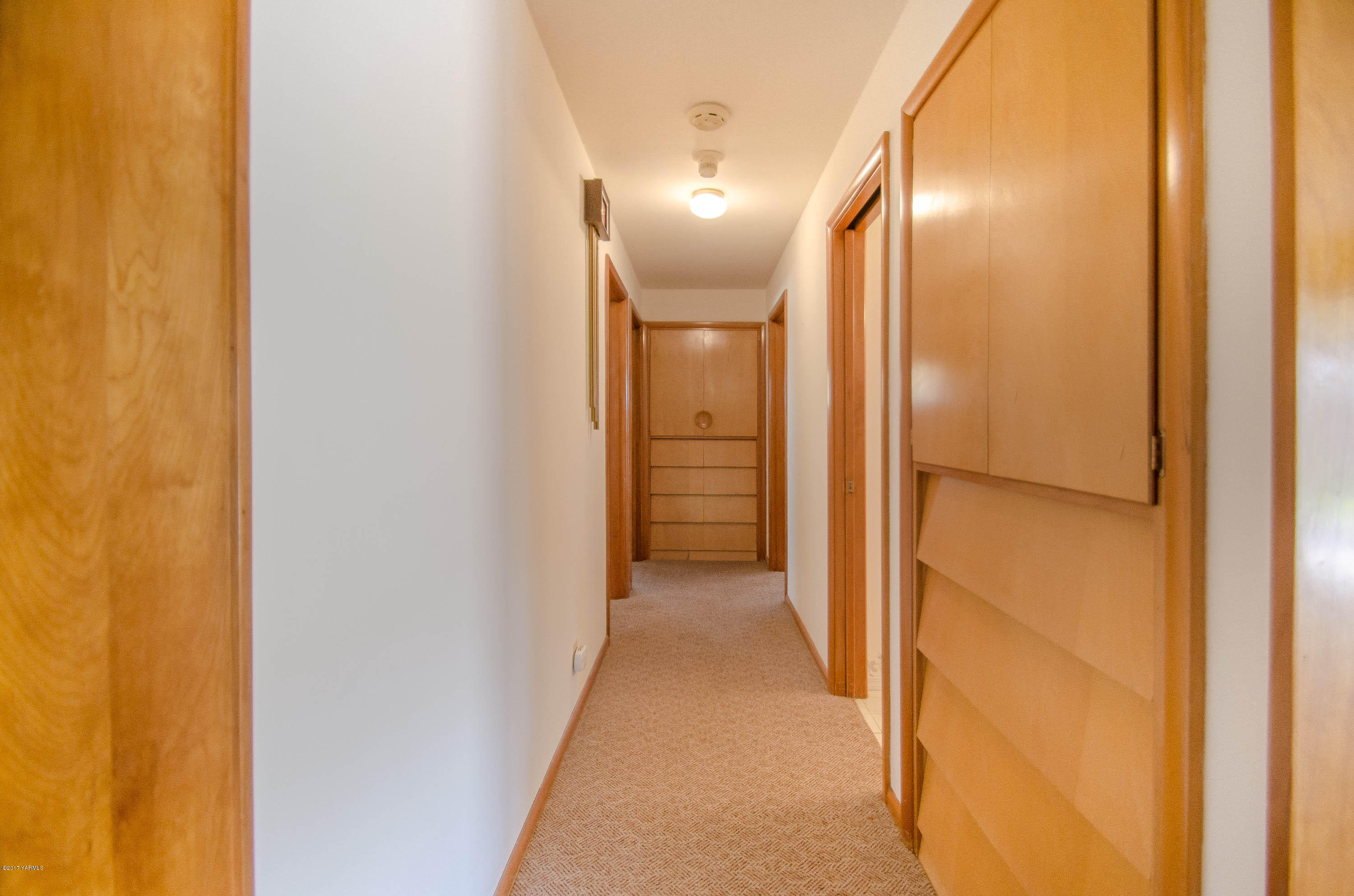 3591 Harrah Road Harrah, WA 98933 - Photo 10 of 20 a view of a hallway with wooden floor