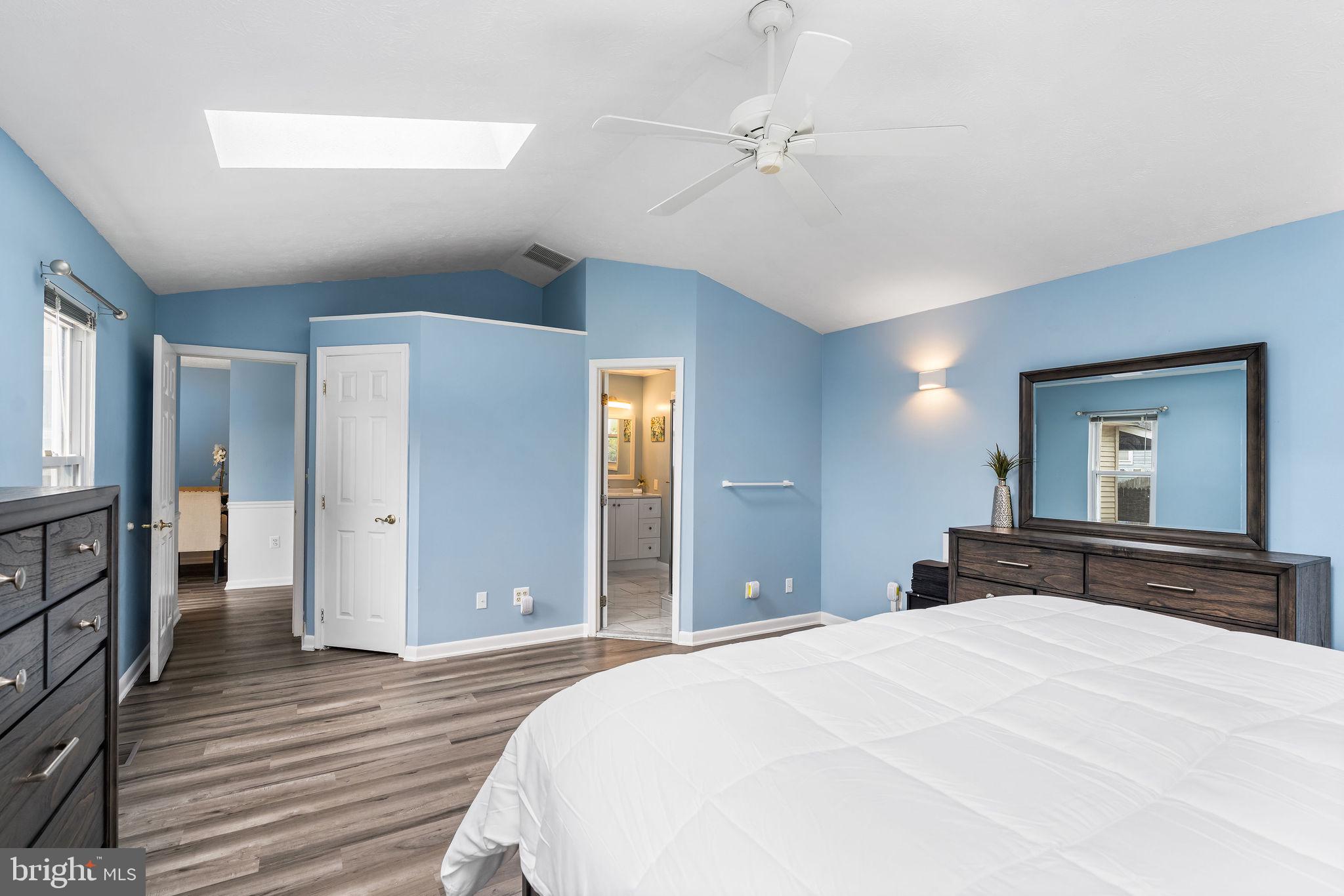 313 Park Hall South Laurel, MD 20724 - Photo 13 of 30 a bedroom with a bed and wooden floor