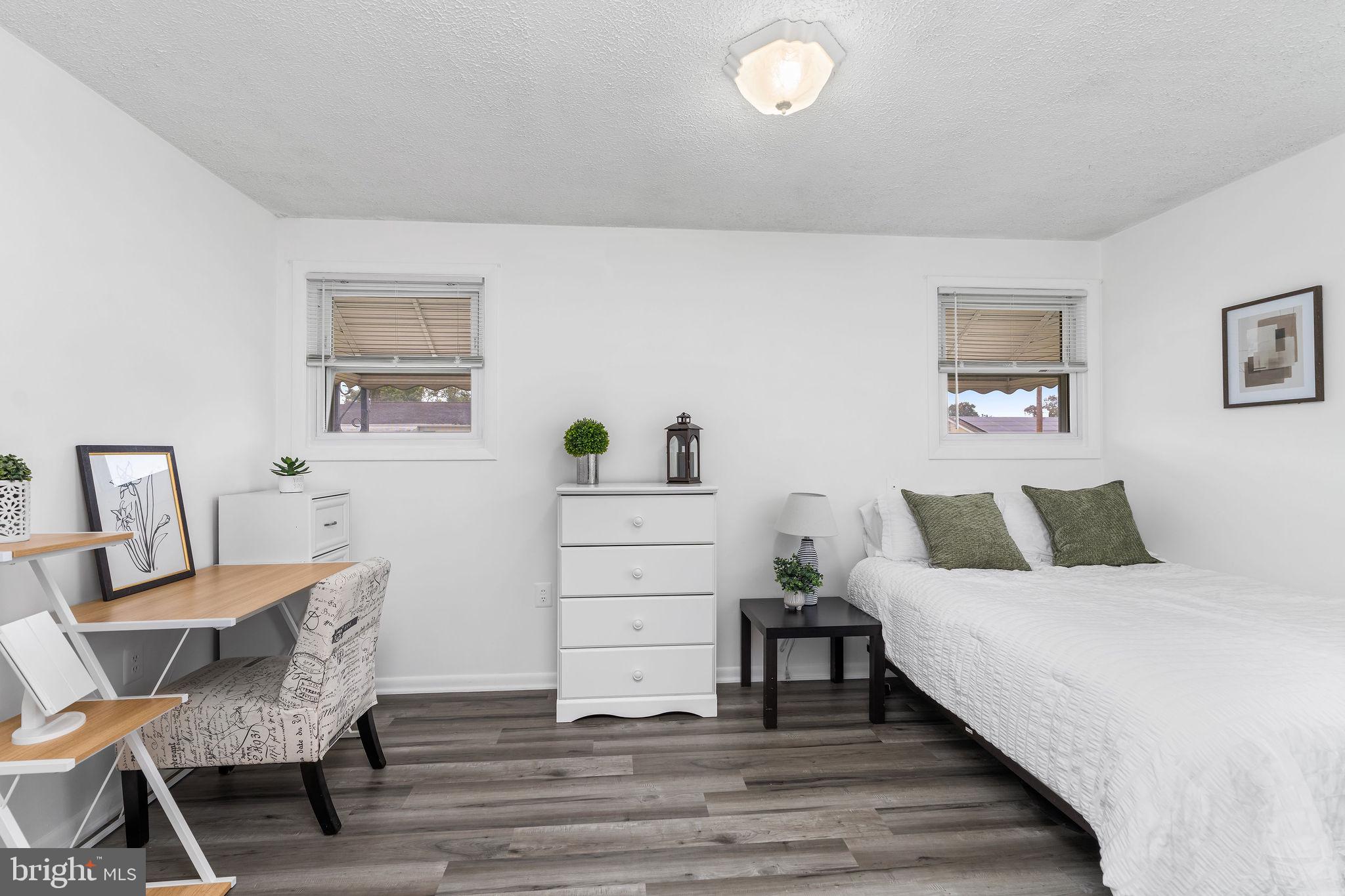 313 Park Hall South Laurel, MD 20724 - Photo 20 of 30 a bedroom with a bed and furniture