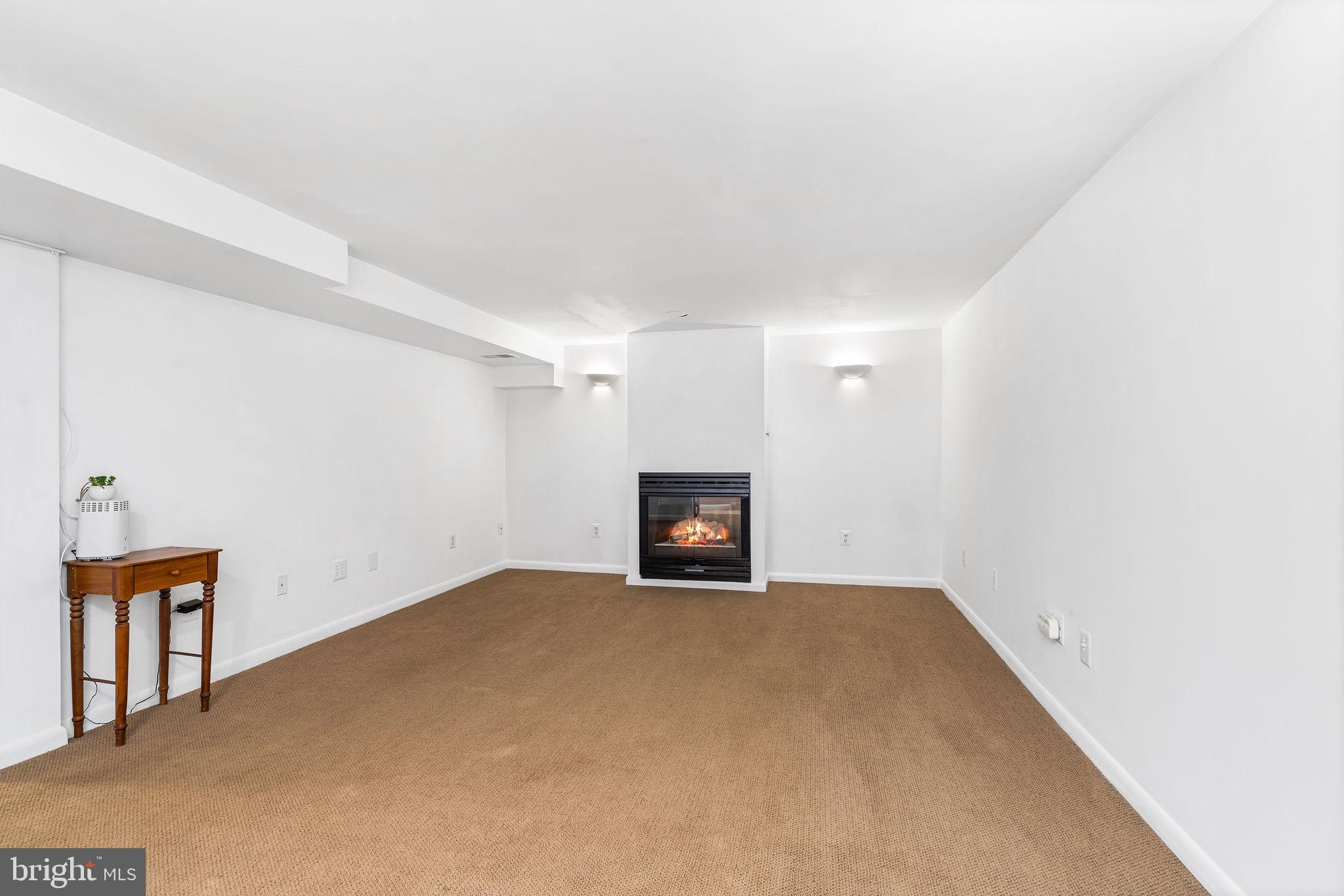 313 Park Hall South Laurel, MD 20724 - Photo 24 of 30 a view of an empty room with a fireplace and a window