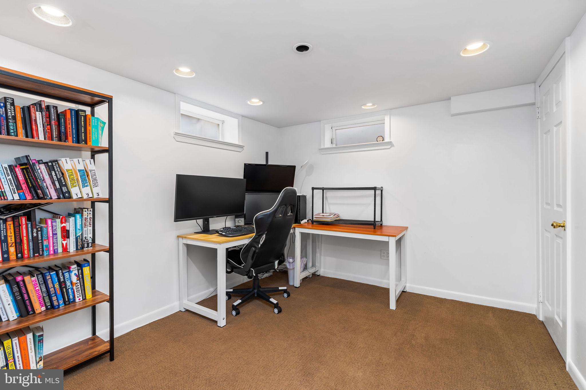 313 Park Hall South Laurel, MD 20724 - Photo 27 of 30 a view of a workspace with furniture and a bookshelf