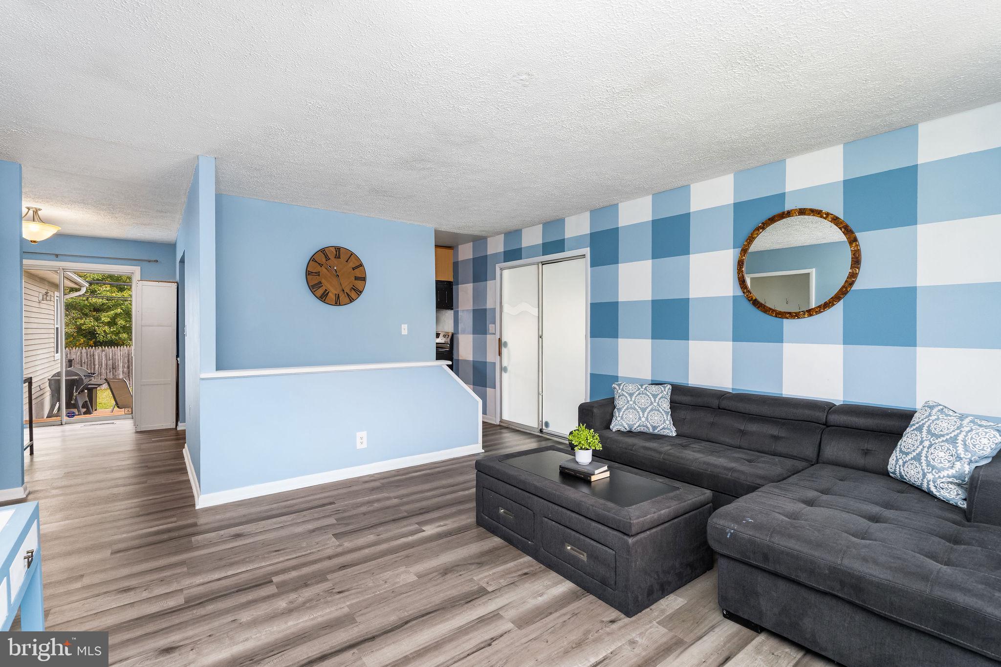 313 Park Hall South Laurel, MD 20724 - Photo 6 of 30 a living room with furniture and wooden floor